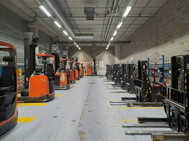 Warehouse with industrial forklifts and equipment